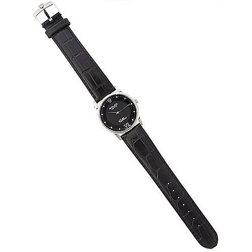 The image shows a top-down view of a Rolex Cellini 5116/9 White Gold Black Dial 5116/9 White Gold Black Dial watch, featuring a black leather strap and a black dial with a silver case.