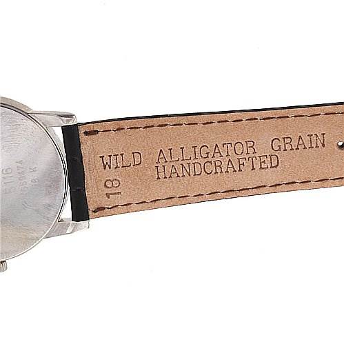 The image shows a side view of the Rolex Cellini 5116/9 White Gold Black Dial 5116/9 White Gold Black Dial watch's back case and leather strap, displaying "Wild Alligator Grain Handcrafted."