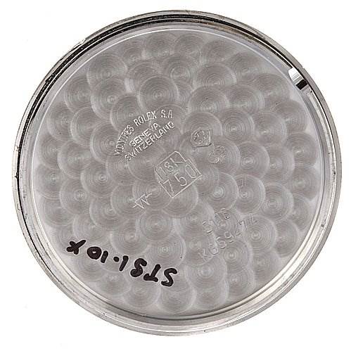 This image shows the inside case back of a Rolex Cellini 5116/9 White Gold Black Dial 5116/9 White Gold Black Dial watch, engraved with markings and model numbers.