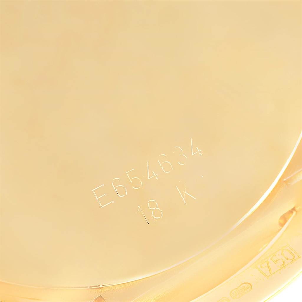 The image shows a close-up of the back casing of a Rolex Cellini 6623 Men's Yellow Gold Champagne Dial 6623 Men's Yellow Gold Champagne Dial watch, highlighting the engraved serial number and "18 K" marking.