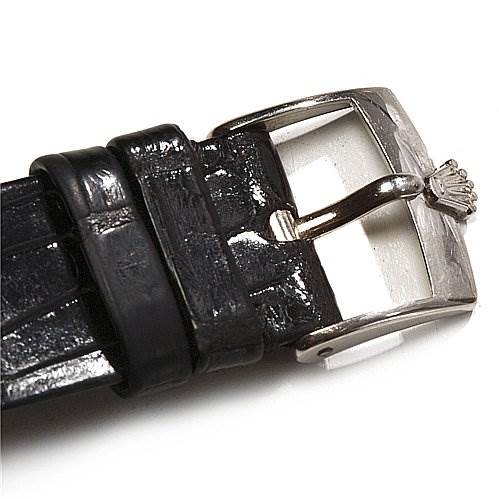 The image shows a close-up of the buckle and part of the black leather strap of a Rolex Cellini 4135 White Gold Silver Dial 4135 White Gold Silver Dial watch.