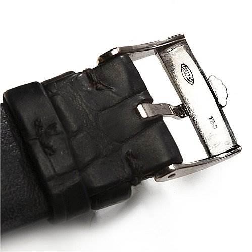 The image shows a close-up of a black leather strap with a metal buckle from a Rolex Cellini 4135 White Gold Silver Dial 4135 White Gold Silver Dial watch.