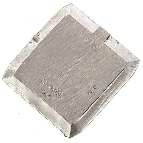 This image shows the case back of a Rolex Cellini 4135 White Gold Silver Dial 4135 White Gold Silver Dial watch, viewed from an overhead angle, highlighting its shape and inscriptions.