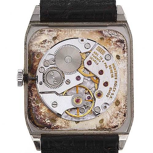 This image shows the inner movement mechanism of the Rolex Cellini 4135 White Gold Silver Dial 4135 White Gold Silver Dial watch from a back angle, revealing gears and components.