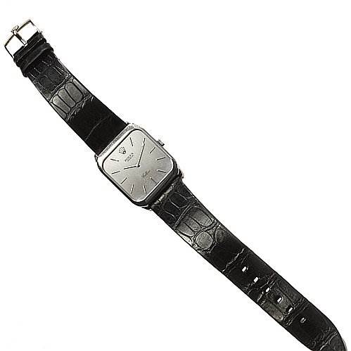 The image shows a top view of a Rolex Cellini 4135 White Gold Silver Dial 4135 White Gold Silver Dial watch with a square face and a black leather strap.