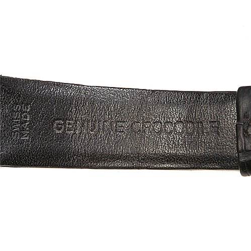 This image shows a close-up view of the leather strap for a Rolex Cellini 4135 White Gold Silver Dial 4135 White Gold Silver Dial watch, with "Genuine Crocodile" embossed.