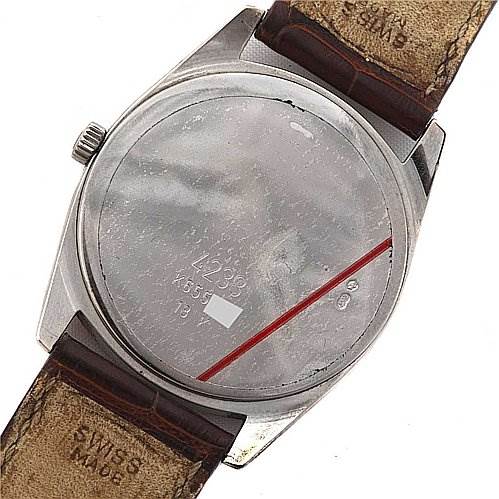 The image shows the back case and leather straps of a Rolex Cellini 4233 White Gold Black Dial 4233 White Gold Black Dial watch, with the crown visible on the side.