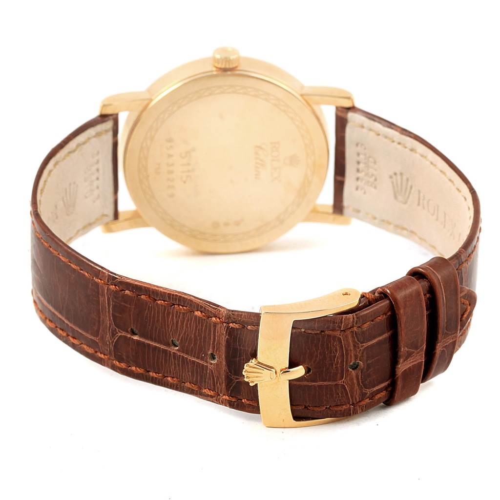 The image displays the back and strap of a Rolex Cellini 5115 Men's Yellow Gold Beige Dial 5115 Men's Yellow Gold Beige Dial watch, highlighting its clasp and leather band.
