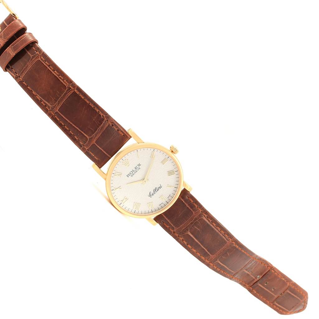 The image shows a Rolex Cellini 5115 Men's Yellow Gold Beige Dial 5115 Men's Yellow Gold Beige Dial watch from a slightly angled top view, emphasizing its dial, case, and brown leather strap.