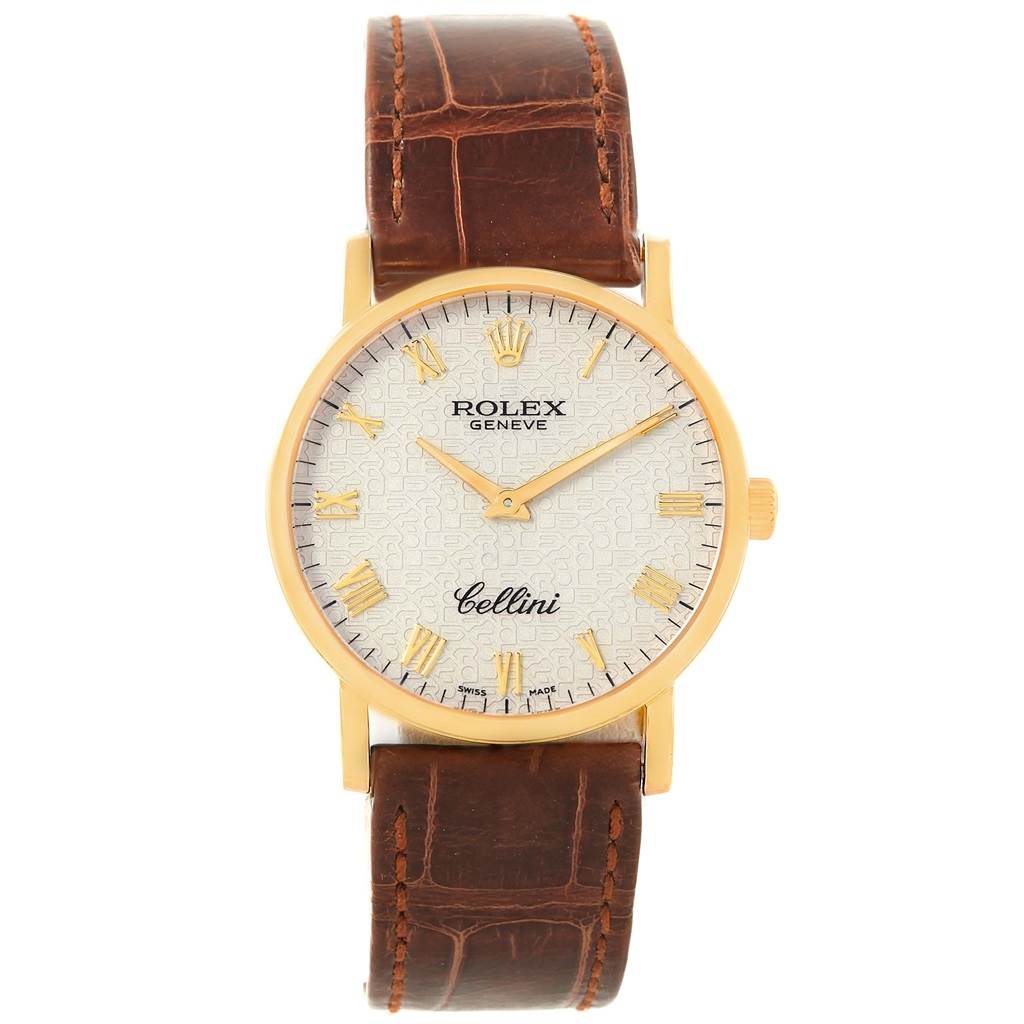 The Rolex Cellini 5115 Men's Yellow Gold Beige Dial 5115 Men's Yellow Gold Beige Dial watch is shown from the front, displaying its face, golden case, and brown leather strap.