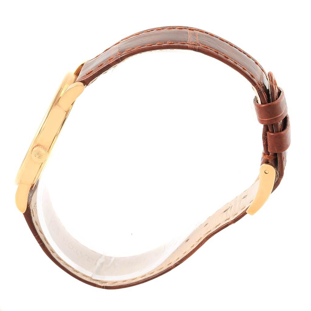 The image shows a side view of a Rolex Cellini 5115 Men's Yellow Gold Beige Dial 5115 Men's Yellow Gold Beige Dial watch, highlighting its brown leather strap and gold case.