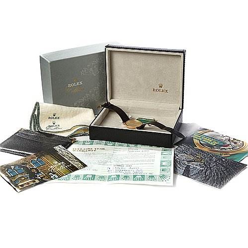 This image shows a Rolex Cellini 4112 Yellow Gold Champagne Dial 4112 Yellow Gold Champagne Dial with its box, documents, cleaning cloth, and brochures from a top-down angle.