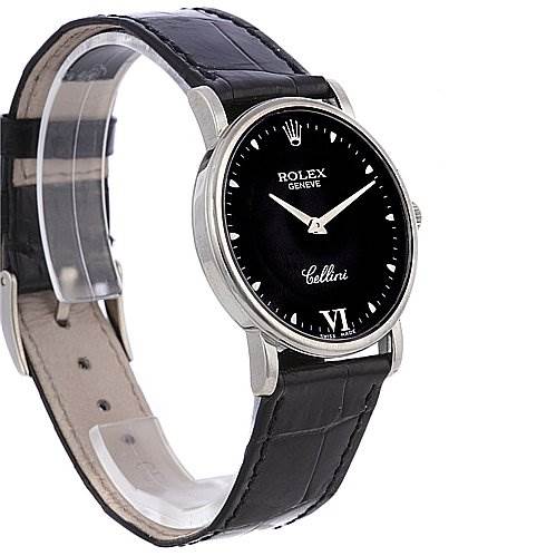 The image shows a Rolex Cellini 5115/9 White Gold Black Dial 5115/9 White Gold Black Dial watch at an angled side view, highlighting the black leather strap and the black dial with silver accents.