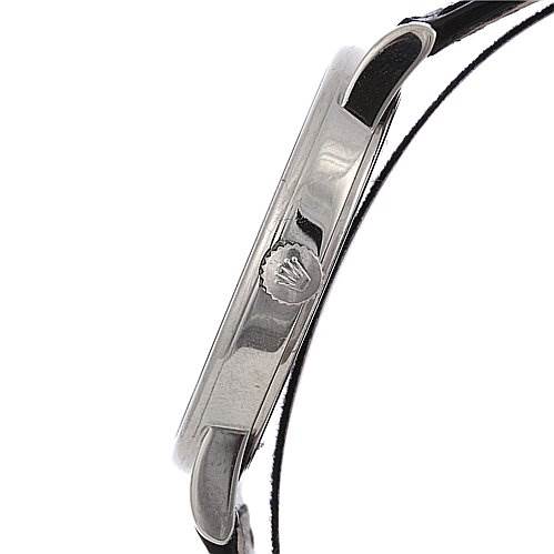 This image shows a side profile of a Rolex Cellini 5115/9 White Gold Black Dial 5115/9 White Gold Black Dial watch, highlighting the case and crown with part of the strap visible.