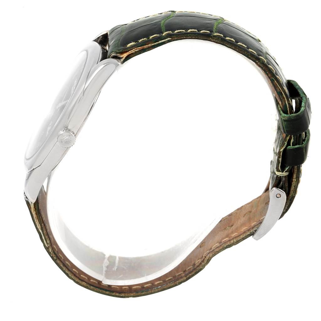 This image shows a side profile of a Rolex Cellini 4233 Men's White Gold Black Dial 4233 Men's White Gold Black Dial watch, highlighting the case, crown, and leather strap with stitching details.