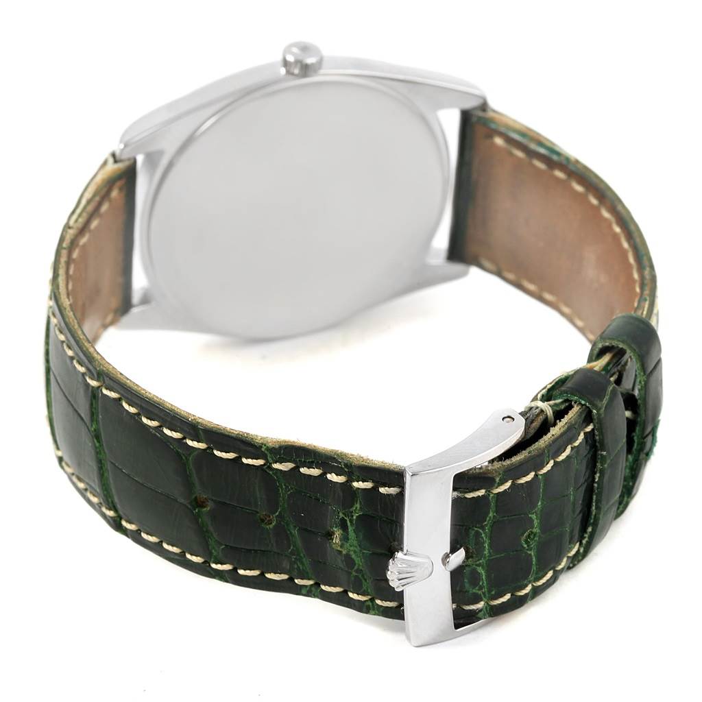 The image shows the back and buckle of a Rolex Cellini 4233 Men's White Gold Black Dial 4233 Men's White Gold Black Dial model with a green leather strap.