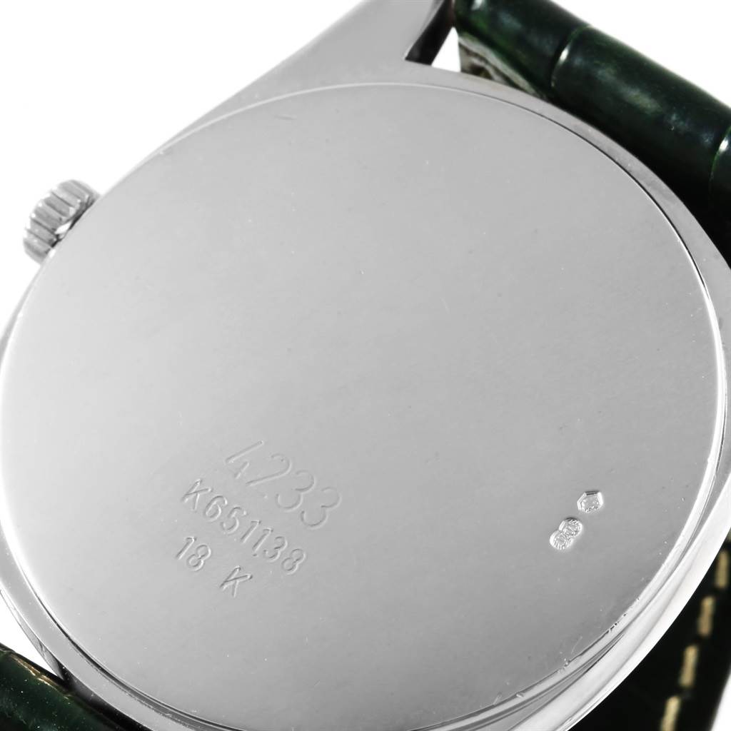 The image shows the back case of a Rolex Cellini 4233 Men's White Gold Black Dial 4233 Men's White Gold Black Dial watch, highlighting its serial number and 18K gold marking.