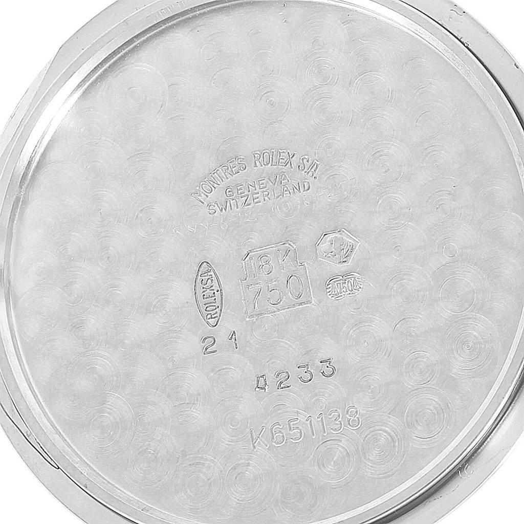 The image shows the inner case back of a Rolex Cellini 4233 Men's White Gold Black Dial 4233 Men's White Gold Black Dial watch with various inscriptions and hallmark stamps.