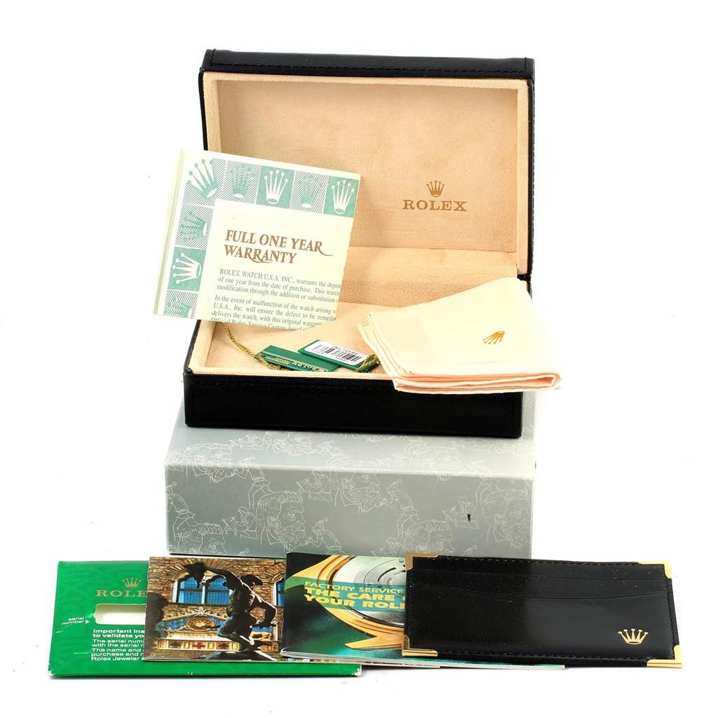 The image shows the packaging, warranty booklet, cleaning cloth, and other documents for a Rolex Cellini 5112 Men's Yellow Gold Beige Dial 5112 Men's Yellow Gold Beige Dial model.
