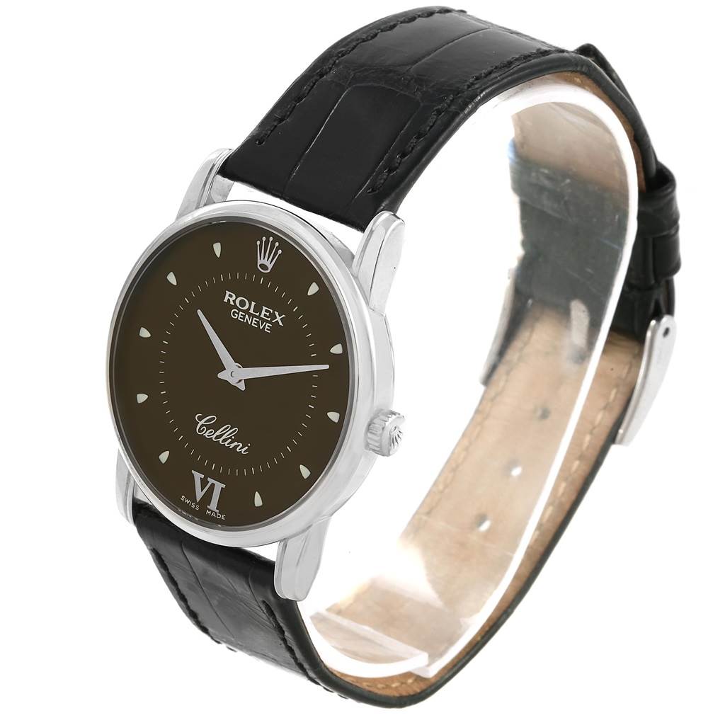 The image shows a Rolex Cellini 5116 Men's White Gold Brown Dial 5116 Men's White Gold Brown Dial watch from an angled side view, highlighting its dial, case, crown, and leather strap.