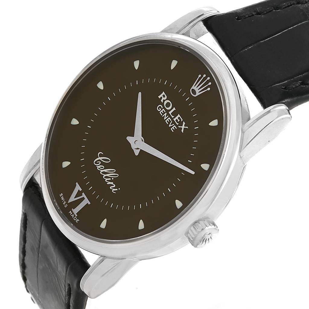 The Rolex Cellini 5116 Men's White Gold Brown Dial 5116 Men's White Gold Brown Dial watch is shown at an angled top-side view, highlighting the dial, crown, case, and part of the black leather strap.