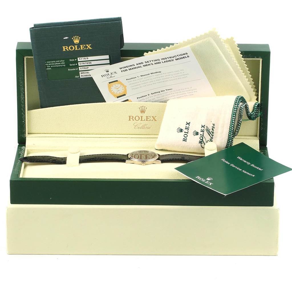 This image shows a Rolex Cellini 5116 Men's White Gold Brown Dial 5116 Men's White Gold Brown Dial watch in its box, accompanied by manuals, a pouch, a cloth, and related documentation.