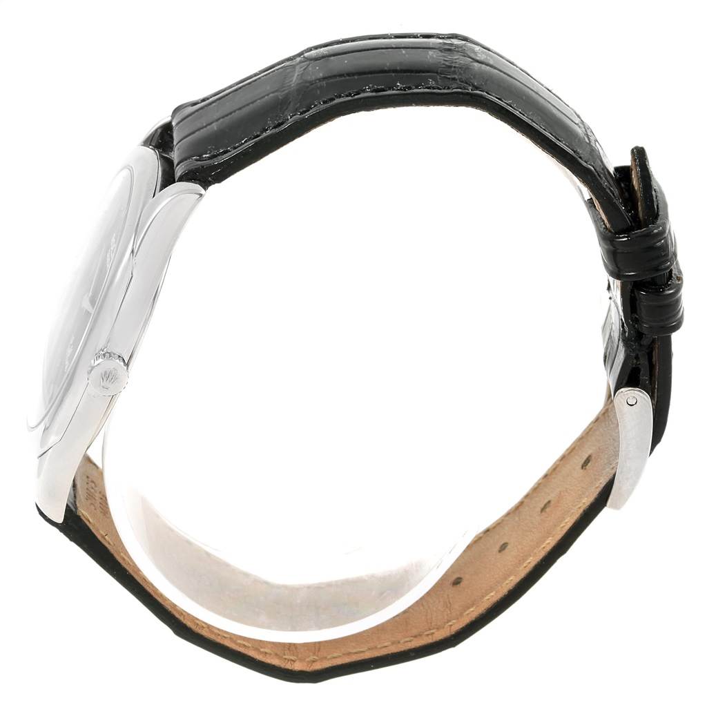 This image shows a side view of a Rolex Cellini 4233 Men's White Gold Black Dial 4233 Men's White Gold Black Dial watch, highlighting the crown, case, and black leather strap.