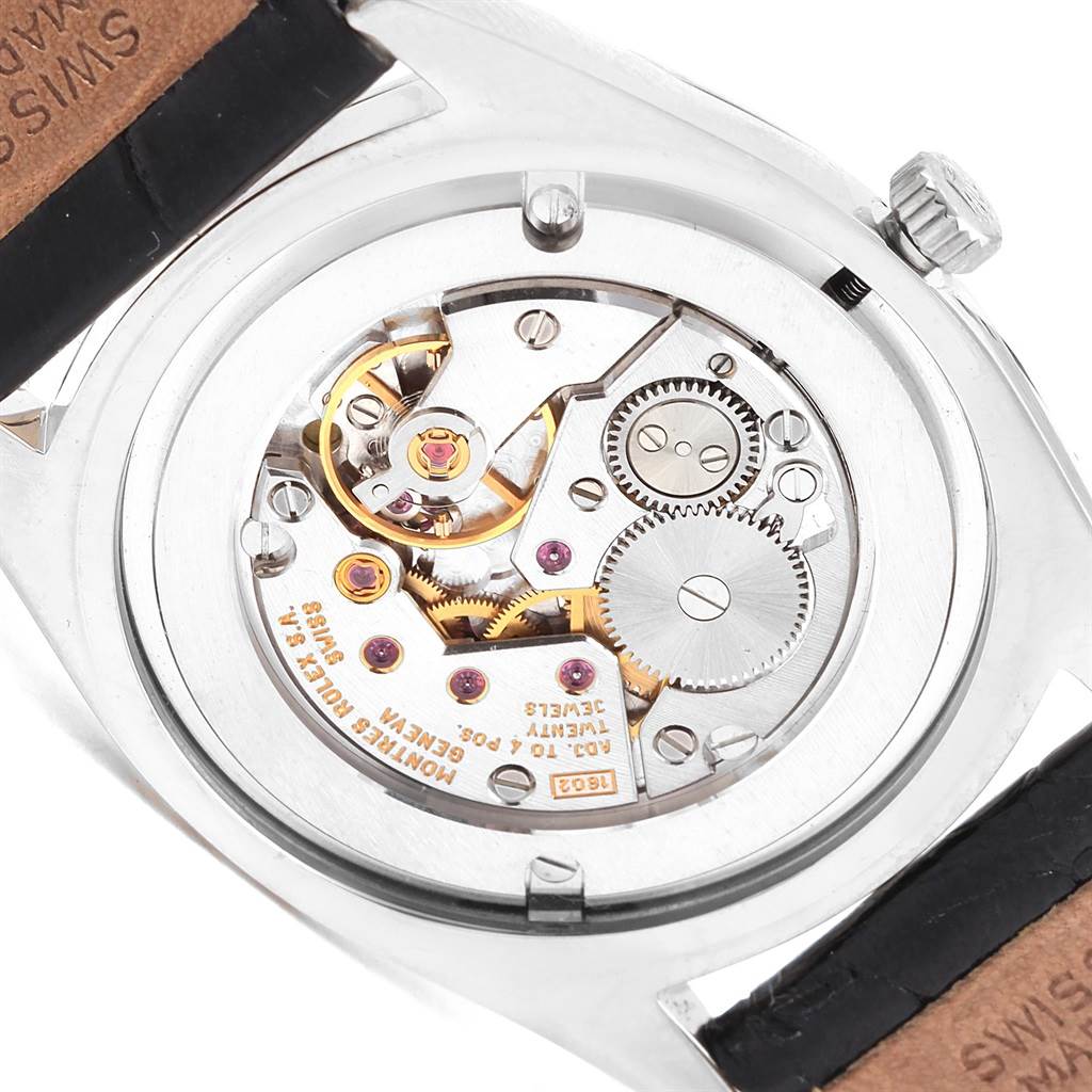 This image shows the internal mechanism of a Rolex Cellini 4233 Men's White Gold Black Dial 4233 Men's White Gold Black Dial watch, focusing on the exposed gears and movement components.