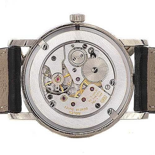 The image shows the back of a Rolex Cellini 5115/9 Men
s White Gold Grey Dial 5115/9 Men
s White Gold Grey Dial watch, revealing the intricate mechanical movement inside.