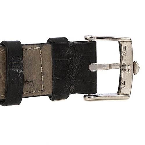 The image shows a close-up of the buckle and part of the leather strap of a Rolex Cellini 5115/9 Men
s White Gold Grey Dial 5115/9 Men
s White Gold Grey Dial watch.