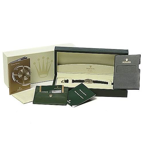 The image shows an angled view of a Rolex Cellini 5115/9 Men
s White Gold Grey Dial 5115/9 Men
s White Gold Grey Dial watch in its box, along with manuals, a warranty card, and packaging.