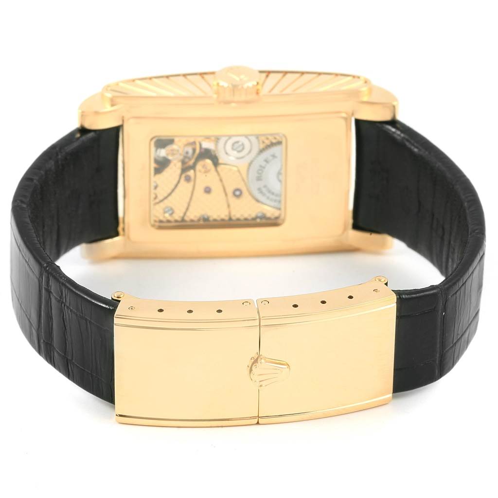 This image shows the back view of a Rolex Cellini 5440/8 Men's Yellow Gold Champagne Dial 5440/8 Men's Yellow Gold Champagne Dial watch, highlighting the movement and the leather strap with a gold clasp.