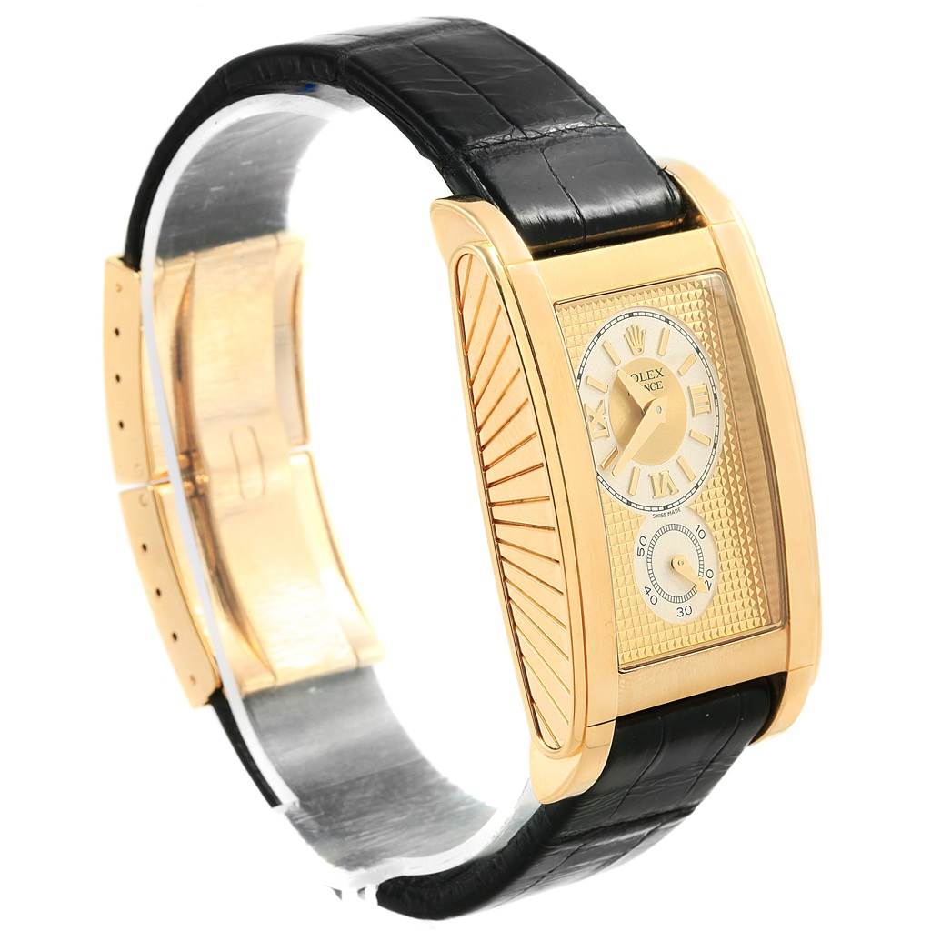 This Rolex Cellini 5440/8 Men's Yellow Gold Champagne Dial 5440/8 Men's Yellow Gold Champagne Dial watch is shown at a right angle, highlighting the gold rectangular case, black leather strap, and intricate dial.