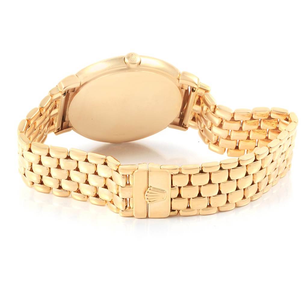 The Rolex Cellini 6622 Women
s Yellow Gold White Dial 6622 Women
s Yellow Gold White Dial watch is shown from the back angle, displaying its case and bracelet clasp.