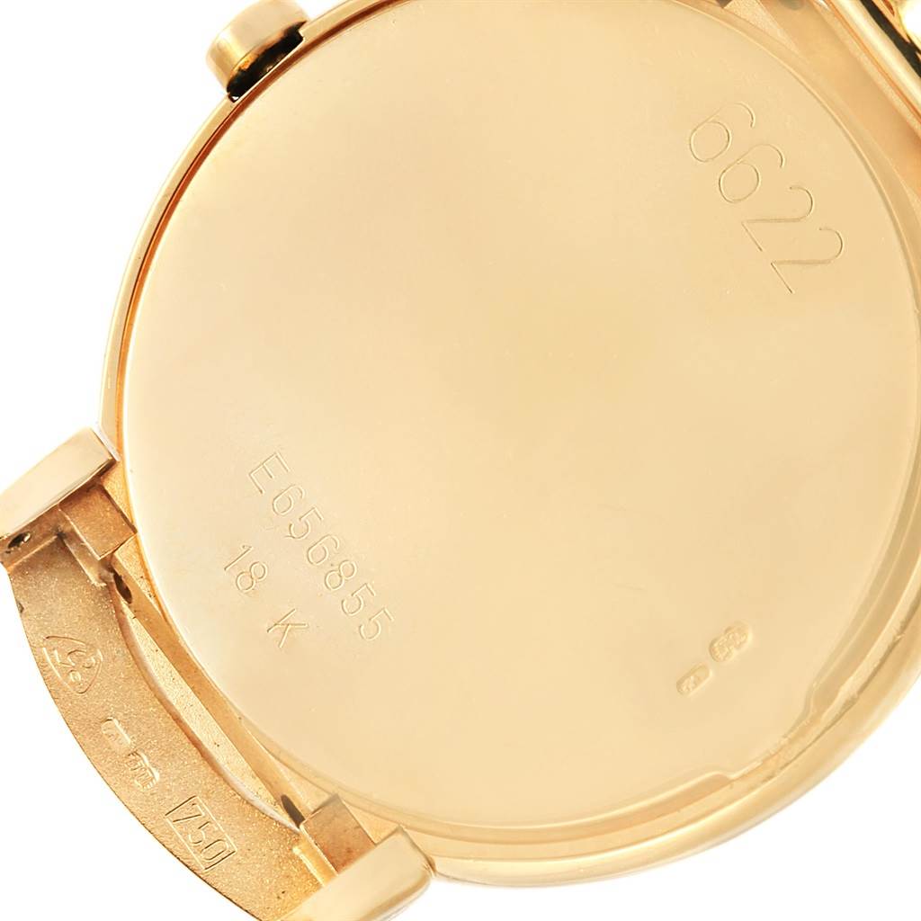 This image shows the back case of a Rolex Cellini 6622 Women
s Yellow Gold White Dial 6622 Women
s Yellow Gold White Dial watch, displaying markings, the model number, and an 18K gold indication.