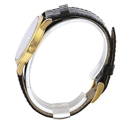 This image shows a side view of the Rolex Cellini 5115 Yellow Gold Black Dial 5115 Yellow Gold Black Dial watch, highlighting its gold casing and black leather strap.