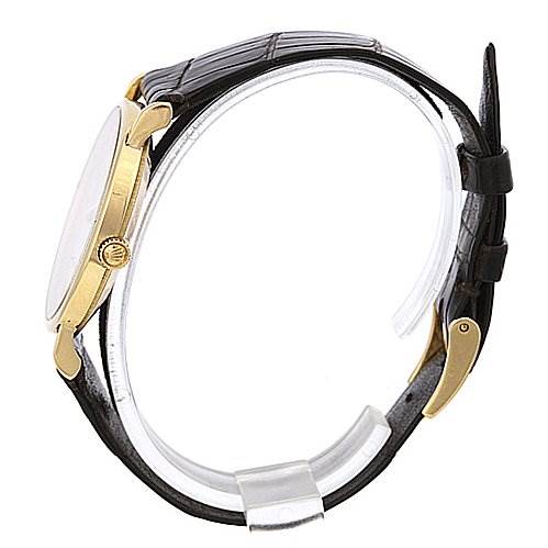 This image shows a side view of a Rolex Cellini 5112 Yellow Gold Champagne Dial 5112 Yellow Gold Champagne Dial watch, highlighting its crown, case, and leather strap.