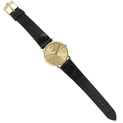The image shows a Rolex Cellini 5112 Yellow Gold Champagne Dial 5112 Yellow Gold Champagne Dial watch with a gold case and black leather strap viewed from the top.