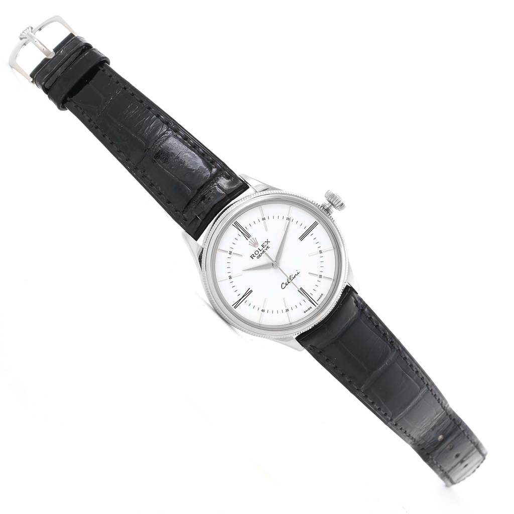 The image shows a Rolex Cellini 50509 Men
s White Gold White Dial 50509 Men
s White Gold White Dial watch at an angled top view, showcasing the dial, case, crown, and leather strap.