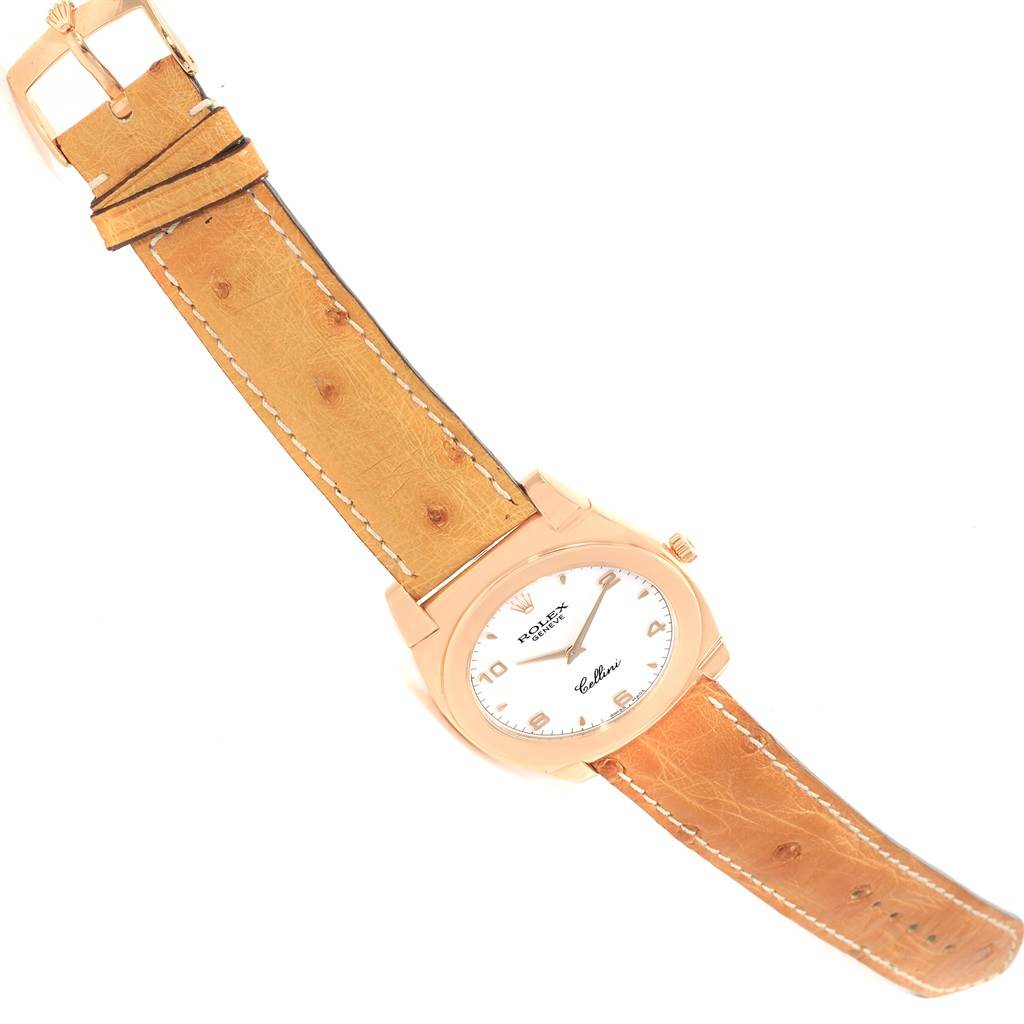 The image shows a Rolex Cellini 5330 Men
s Rose Gold White Dial 5330 Men
s Rose Gold White Dial watch laid flat, displaying its face, crown, and leather strap.