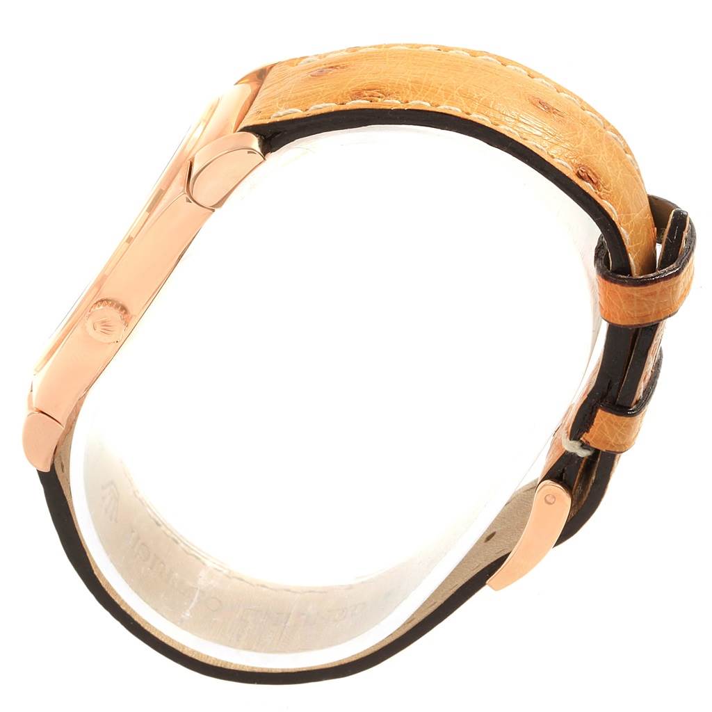 The image shows a side view of the Rolex Cellini 5330 Men
s Rose Gold White Dial 5330 Men
s Rose Gold White Dial watch, highlighting its case, strap, and part of the buckle.