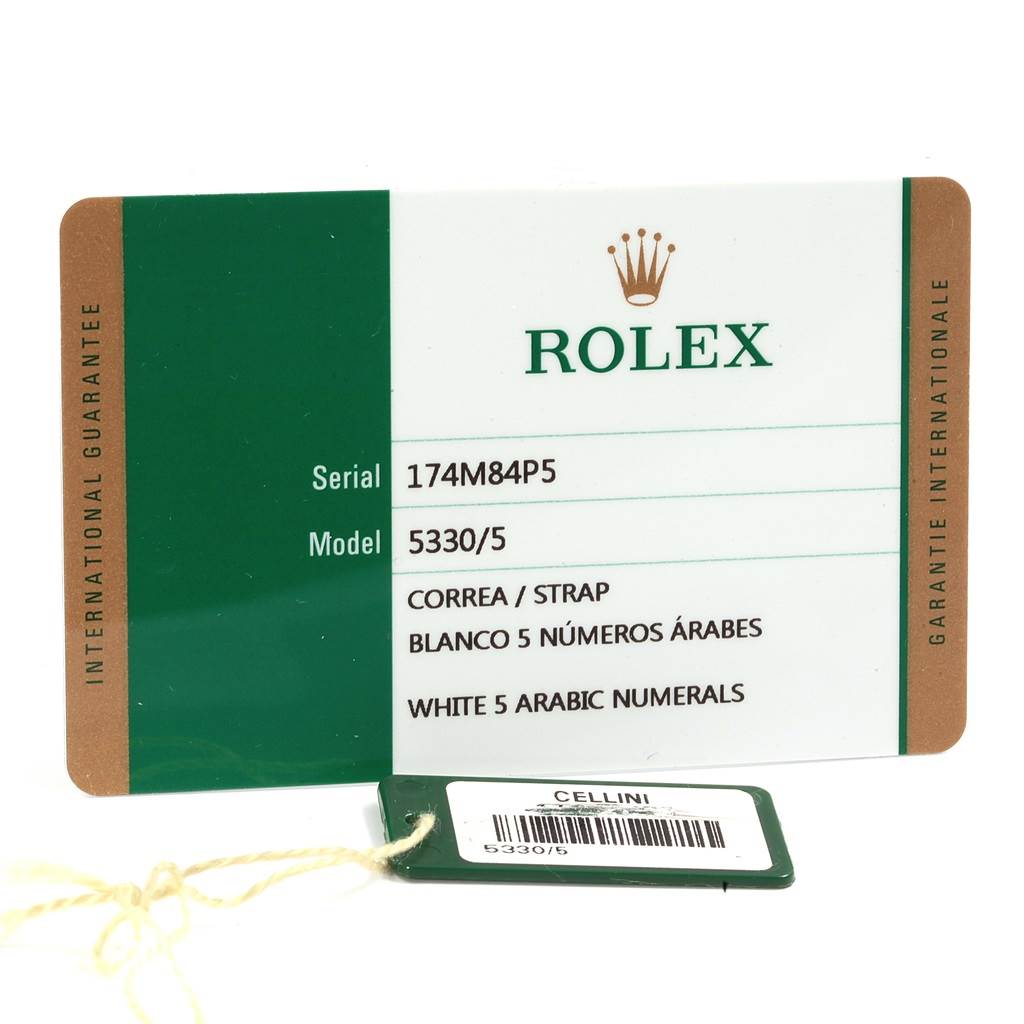 This image shows the guarantee card and tag for a Rolex Cellini 5330 Men
s Rose Gold White Dial 5330 Men
s Rose Gold White Dial model 5330/5 watch.