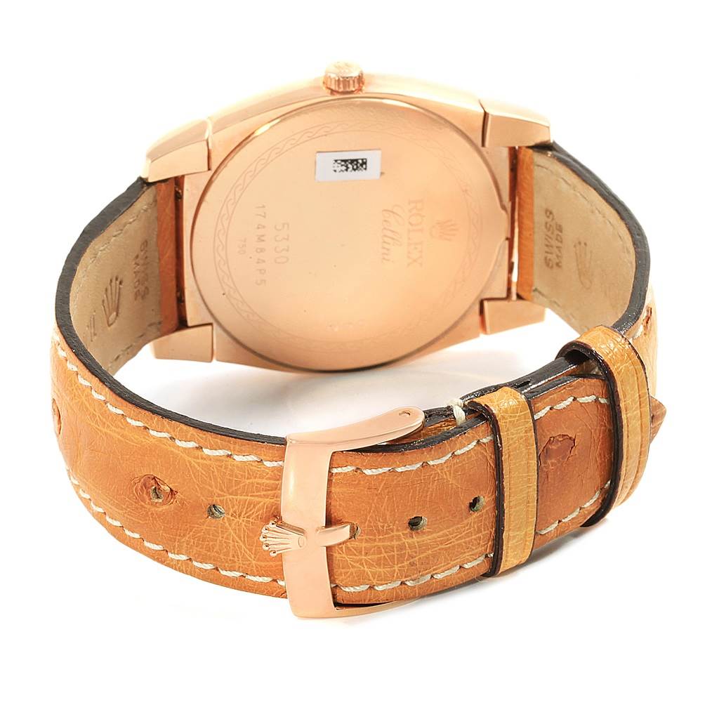 The image shows the back view of a Rolex Cellini 5330 Men
s Rose Gold White Dial 5330 Men
s Rose Gold White Dial watch, including its case, lugs, and brown leather strap with a buckle.