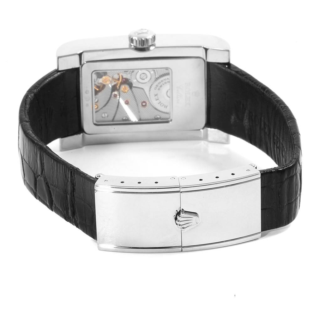 The Rolex Cellini 5441 Men
s White Gold Silver Dial 5441 Men
s White Gold Silver Dial watch is shown from the back, featuring its exposed movement, black leather strap, and clasp with Rolex
s logo.
