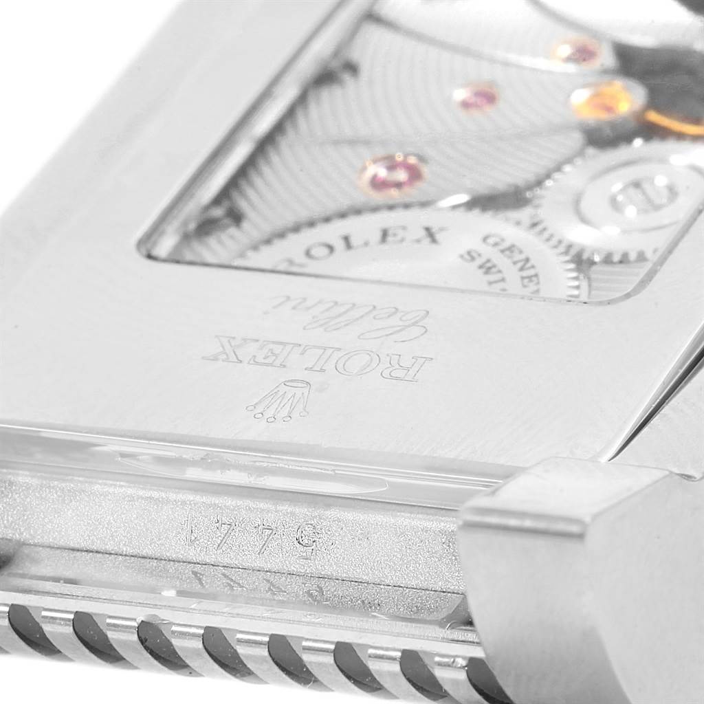 This close-up image of a Rolex Cellini 5441 Men
s White Gold Silver Dial 5441 Men
s White Gold Silver Dial model shows the back case, revealing parts of the inner movement and engravings.