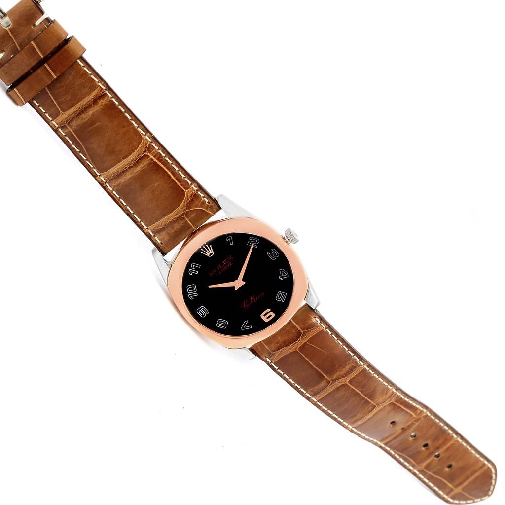 The image shows a top view of the Rolex Cellini 4233 Men's White Gold Black Dial 4233 Men's White Gold Black Dial watch, displaying its brown leather strap, black dial, and rose gold case.