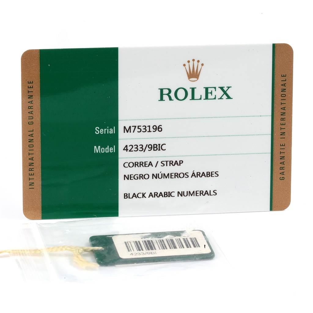 The image shows the warranty and serial card for a Rolex Cellini 4233 Men's White Gold Black Dial 4233 Men's White Gold Black Dial model along with a tag displaying the model number.