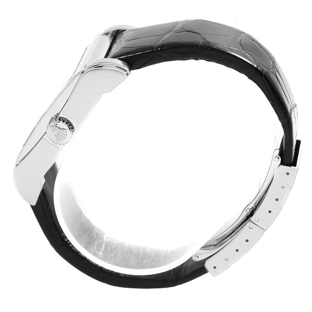 The image shows a side view of the Rolex Cellini 5443/9 Men
s White Gold Black Dial 5443/9 Men
s White Gold Black Dial watch, focusing on its clasp and a portion of the black leather strap.