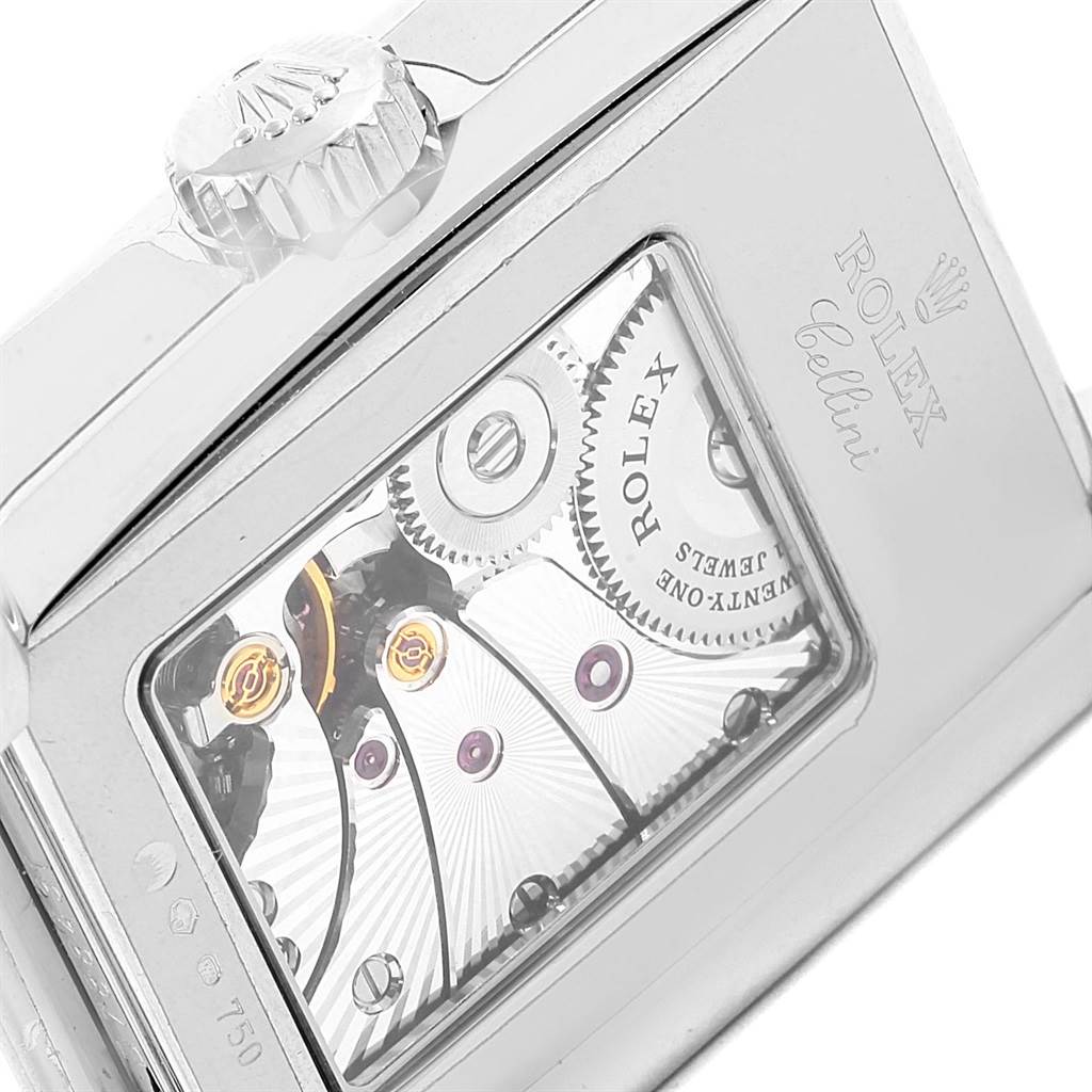 This image shows a close-up of the back of a Rolex Cellini 5443/9 Men
s White Gold Black Dial 5443/9 Men
s White Gold Black Dial watch, highlighting the movement and the winding crown.