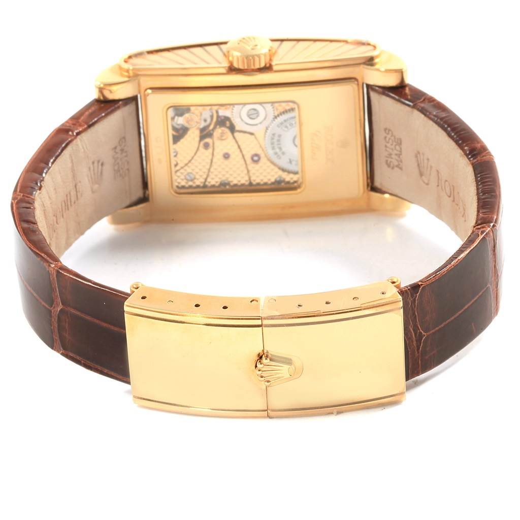 The image shows the back view of a Rolex Cellini 5440/8 Men's Yellow Gold Champagne Dial 5440/8 Men's Yellow Gold Champagne Dial watch, featuring its mechanism, leather strap, and gold clasp.